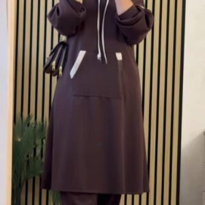 A modest long hoodie outfit featuring a relaxed silhouette with a drawstring hood and a large kangaroo pocket. Designed for comfort, full coverage, and effortless everyday modestwear.