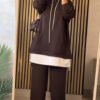 EaseLayer Set A modest two-piece outfit featuring a long layered hoodie-style top with a relaxed fit, drawstring detail, and wide-leg trousers. Designed for comfort, coverage, and modern modest style.