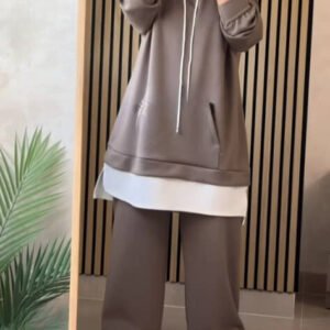 EaseLayer Set A modest two-piece outfit featuring a long layered hoodie-style top with a relaxed fit, drawstring detail, and wide-leg trousers. Designed for comfort, coverage, and modern modest style.