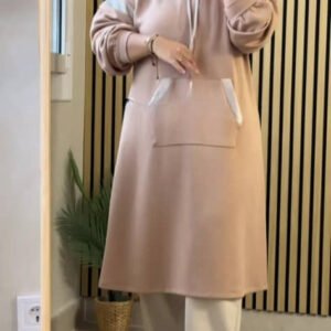 A modest long hoodie outfit featuring a relaxed silhouette with a drawstring hood and a large kangaroo pocket. Designed for comfort, full coverage, and effortless everyday modestwear.