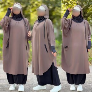 A modest sporty jilbab featuring a relaxed, flowy silhouette with a hood, thumbhole cuffs, and side pockets. Styled for comfort, flexibility, and full coverage in active or casual settings.