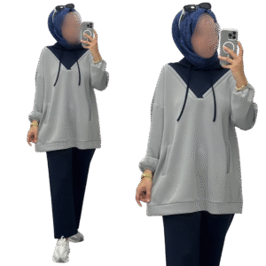 A modest two-piece outfit featuring a relaxed long-sleeve hoodie-style top with a V-neck panel and adjustable drawstrings, paired with wide-leg trousers. Designed for effortless comfort, full coverage, and a contemporary modest look suitable for casual or active wear.