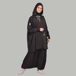 A modest sporty outfit featuring a relaxed hooded top with adjustable drawstrings, front kangaroo pocket, and loose trousers. Designed for full coverage, easy movement, and everyday comfort.