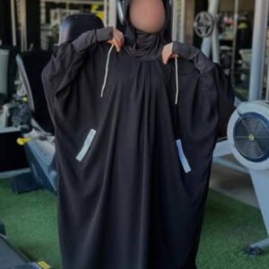 A modest sporty jilbab featuring a relaxed, flowy silhouette with a hood, thumbhole cuffs, and side pockets. Styled for comfort, flexibility, and full coverage in active or casual settings.