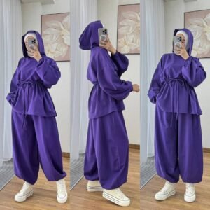 Modest two-piece women’s sporty outfit in many colors featuring a loose-fit hooded top with adjustable drawstring waist and wide-leg trousers, styled with an inner hijab cap