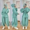 Modest two-piece women’s sporty outfit in many colors featuring a loose-fit hooded top with adjustable drawstring waist and wide-leg trousers, styled with an inner hijab cap