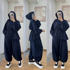 Modest two-piece women’s sporty outfit in many colors featuring a loose-fit hooded top with adjustable drawstring waist and wide-leg trousers, styled with an inner hijab cap