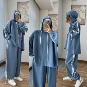 EaseFit Modest Tracksuit featuring a relaxed hooded top with white drawstrings and wide-leg trousers with side tie details, designed for modest comfort and sporty style, styled with a white inner hijab and sneakers in a soft indoor setting