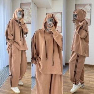 EaseFit Modest Tracksuit featuring a relaxed hooded top with white drawstrings and wide-leg trousers with side tie details, designed for modest comfort and sporty style, styled with a white inner hijab and sneakers in a soft indoor setting