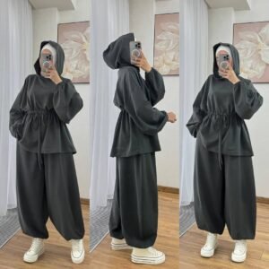 Modest two-piece women’s sporty outfit in many colors featuring a loose-fit hooded top with adjustable drawstring waist and wide-leg trousers, styled with an inner hijab cap