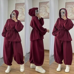 Modest two-piece women’s sporty outfit in many colors featuring a loose-fit hooded top with adjustable drawstring waist and wide-leg trousers, styled with an inner hijab cap