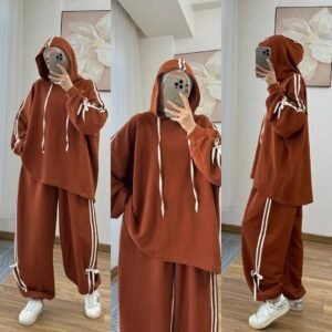 EaseFit Modest Tracksuit featuring a relaxed hooded top with white drawstrings and wide-leg trousers with side tie details, designed for modest comfort and sporty style, styled with a white inner hijab and sneakers in a soft indoor setting