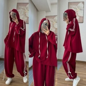 EaseFit Modest Tracksuit featuring a relaxed hooded top with white drawstrings and wide-leg trousers with side tie details, designed for modest comfort and sporty style, styled with a white inner hijab and sneakers in a soft indoor setting