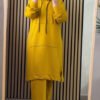 A modest two-piece tracksuit featuring top with contrast sleeves and relaxed wide-leg trousers. Designed for coverage, comfort, and sporty modest elegance.