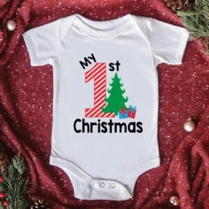 White baby romper with Santa Claus print and “Baby’s 1st Christmas” text — First Christmas Magic edition.
