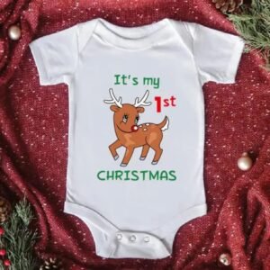 White baby romper with Santa Claus print and “Baby’s 1st Christmas” text — First Christmas Magic edition.