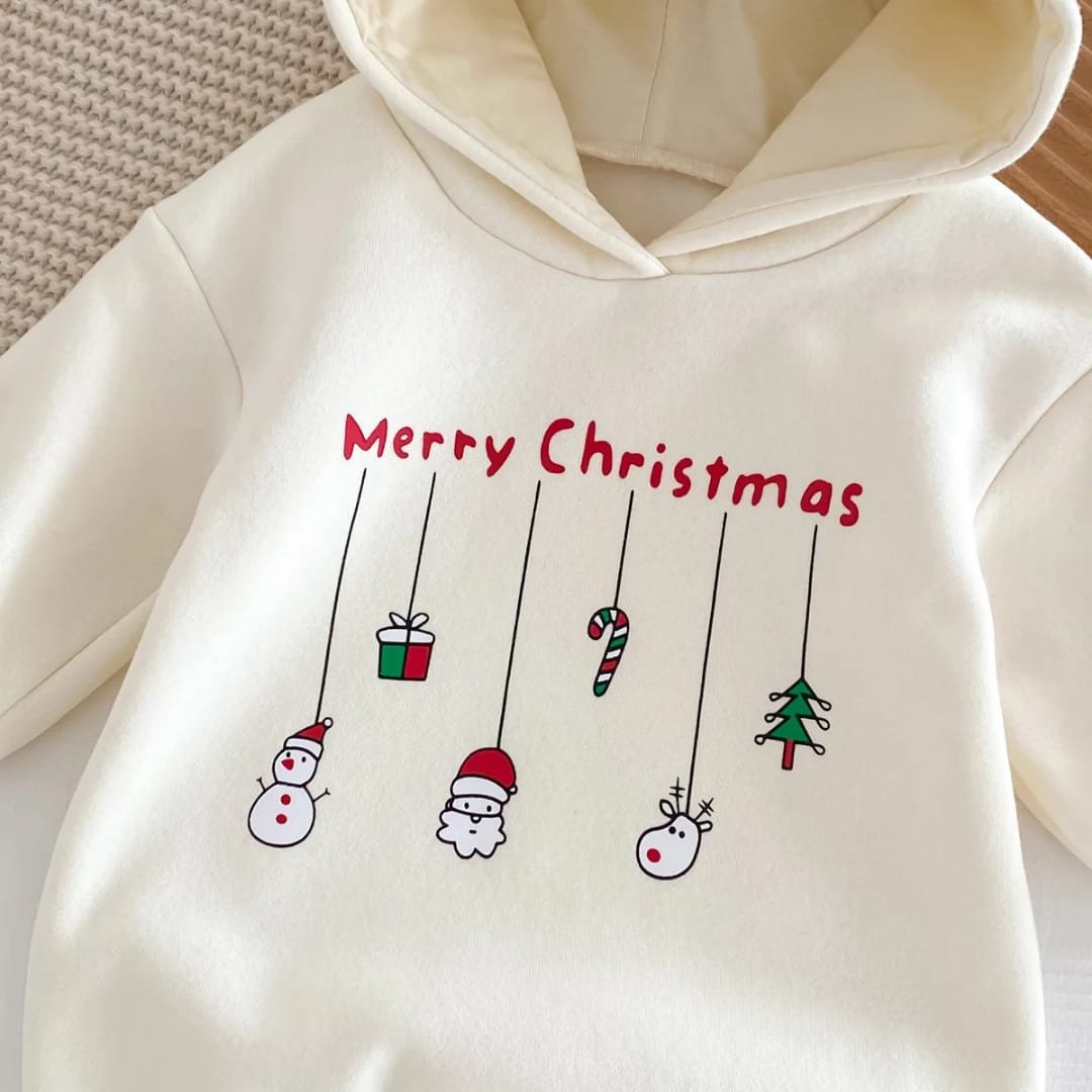 Baby Christmas romper with hoodie and red pom-pom, decorated with hanging festive icons including Santa, snowman, gift box, candy cane, and Christmas tree — “Festive Dangles” design.