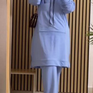 A modest two-piece tracksuit featuring top with contrast sleeves and relaxed wide-leg trousers. Designed for coverage, comfort, and sporty modest elegance.