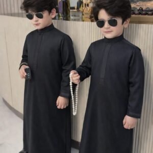 Boy wearing Monarch Signature traditional outfit with modern panel design and detailed sleeves.