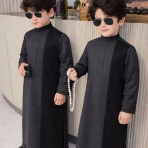 Boy wearing Monarch Signature traditional outfit with modern panel design and detailed sleeves.