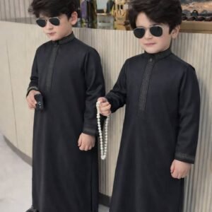 Boy wearing Monarch Signature traditional outfit with modern panel design and detailed sleeves.