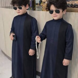 Boy wearing Monarch Signature traditional outfit with modern panel design and detailed sleeves.