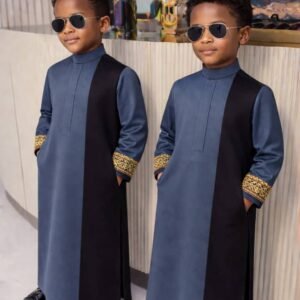 Boy wearing Monarch Signature traditional outfit with modern panel design and detailed sleeves.