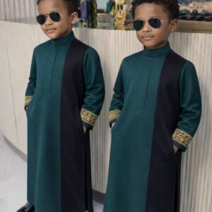 Boy wearing Monarch Signature traditional outfit with modern panel design and detailed sleeves.