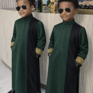 Boy wearing Monarch Signature traditional outfit with modern panel design and detailed sleeves.