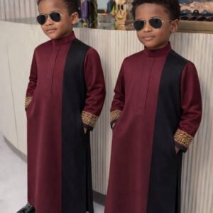 Boy wearing Monarch Signature traditional outfit with modern panel design and detailed sleeves.